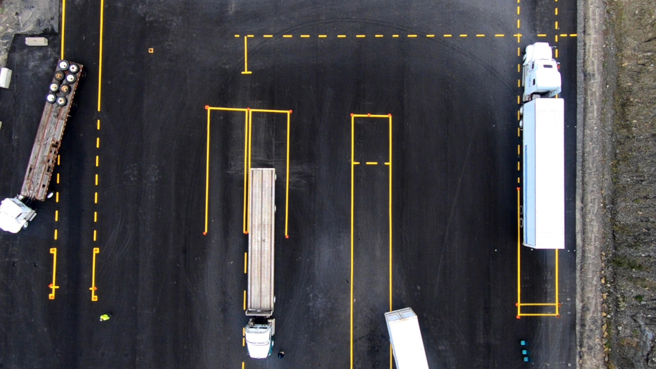 Aerial view of trucks in industrial parking lot