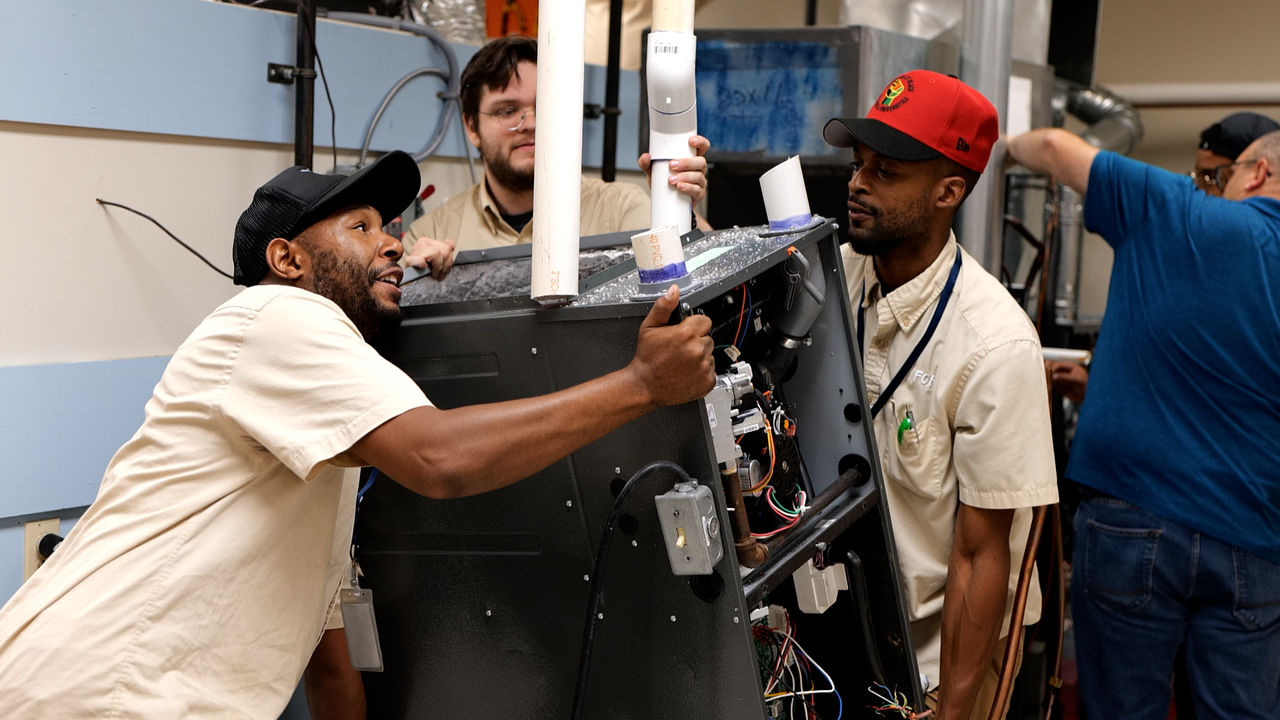 Technicians Collaborate on Large Industrial Equipment Assembly
